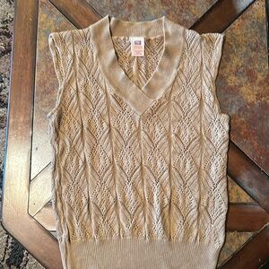 Vintage vest. Size large but fits a medium better. Used condition.